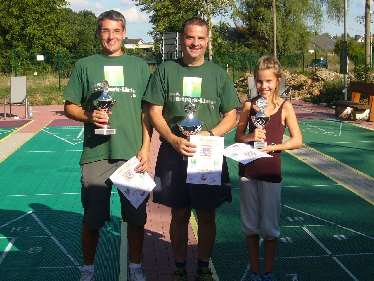 Stefan Stadtmüller (2.), Hubert Fluck (1.), Fabienne Fluck (3.), v.l.